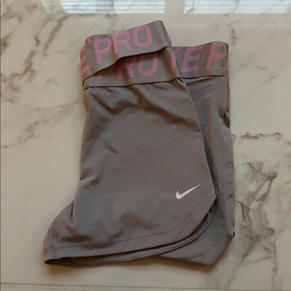 Grey and Pink Nike Pros